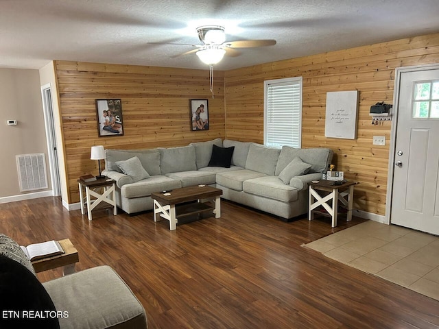 935 Pinetree Rd, Jamestown, TN 38556 - living area featuring ceiling fan, wood walls, and wood finished floors