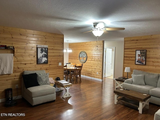 935 Pinetree Rd, Jamestown, TN 38556 - living area with a ceiling fan, wood walls, wood finished floors, a chandelier, and a textured ceiling
