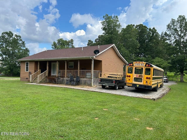 935 Pinetree Rd, Jamestown, TN 38556 - back of house with covered porch, a yard, and crawl space