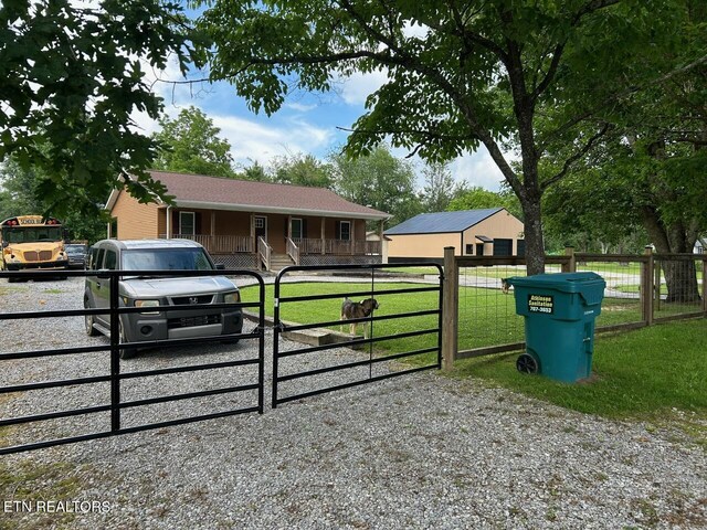 935 Pinetree Rd, Jamestown, TN 38556 - single story home featuring a gate, covered porch, and a fenced front yard