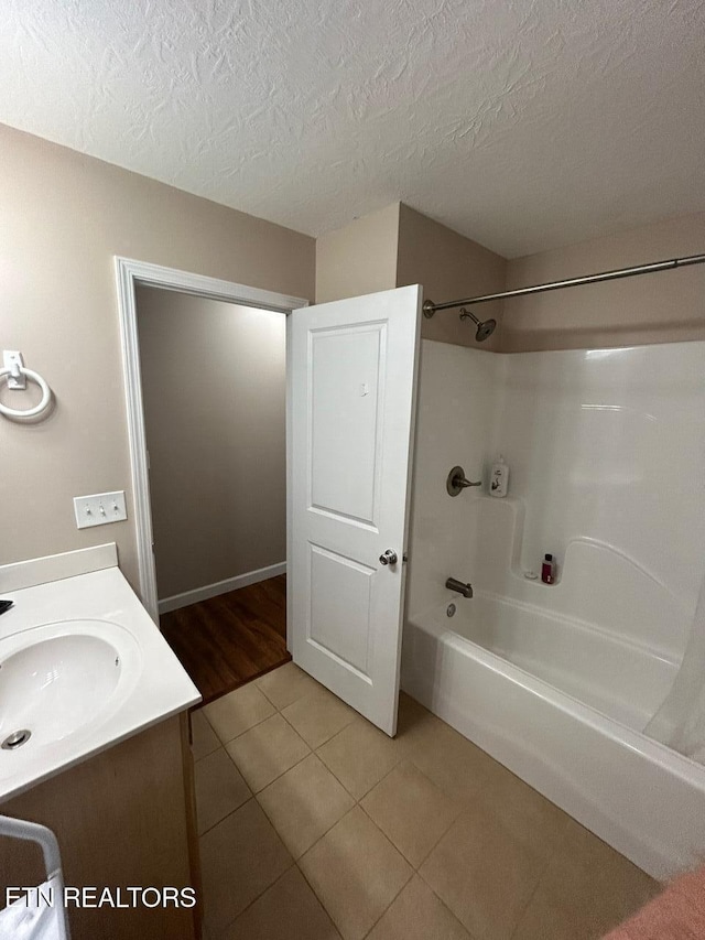 935 Pinetree Rd, Jamestown, TN 38556 - full bathroom with washtub / shower combination, tile patterned flooring, vanity, and a textured ceiling