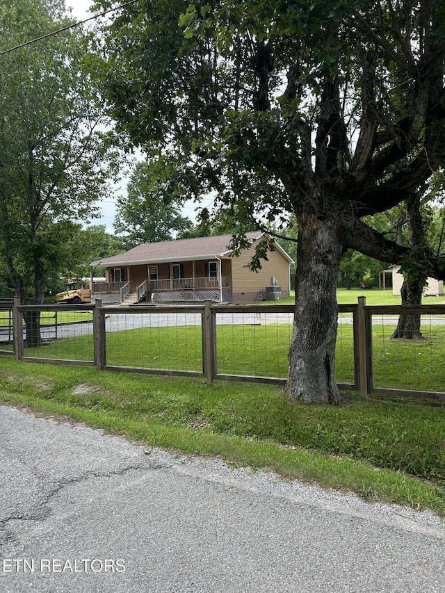 935 Pinetree Rd, Jamestown, TN 38556 - single story home with a fenced front yard and a porch