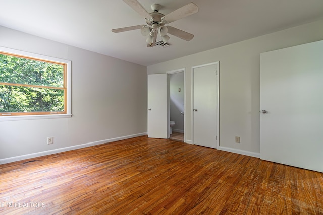 128 Orchard Ln, Oak Ridge, TN 37830 - unfurnished bedroom featuring wood finished floors and a ceiling fan