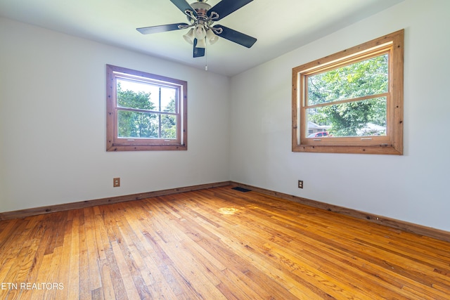 128 Orchard Ln, Oak Ridge, TN 37830 - spare room featuring healthy amount of natural light, light wood-style flooring, and a ceiling fan
