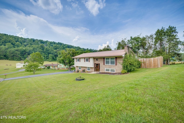 5122 Moody Dr, Kingsport, TN 37664 - raised ranch featuring a chimney, a front lawn, and driveway