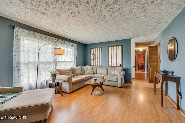 5122 Moody Dr, Kingsport, TN 37664 - living room with light wood-type flooring and a textured ceiling
