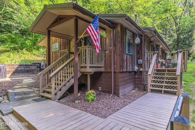 305 Shields View Dr, Gatlinburg, TN 37738 - wooden deck with stairway and a wooded view