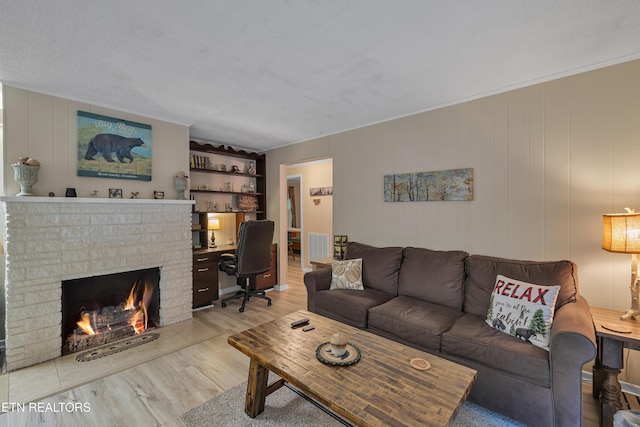 305 Shields View Dr, Gatlinburg, TN 37738 - living area featuring wood finished floors and a brick fireplace