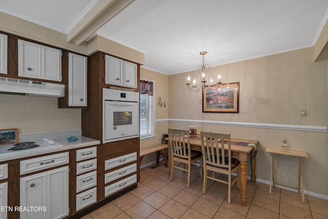 305 Shields View Dr, Gatlinburg, TN 37738 - kitchen featuring white appliances, light tile patterned floors, a chandelier, light countertops, and ornamental molding
