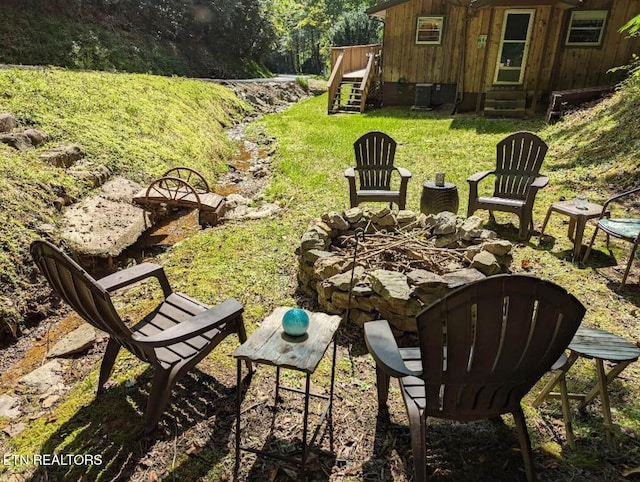 305 Shields View Dr, Gatlinburg, TN 37738 - view of green lawn featuring a fire pit, entry steps, and stairway