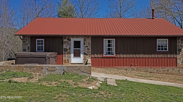 805 Punkton Rd, Del Rio, TN 37727 - view of front of house with a hot tub, stone siding, and a metal roof