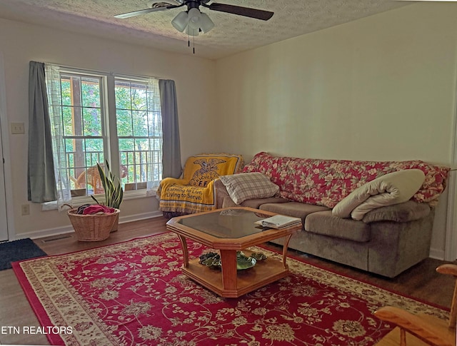 805 Punkton Rd, Del Rio, TN 37727 - living area with a textured ceiling, ceiling fan, healthy amount of natural light, and wood finished floors