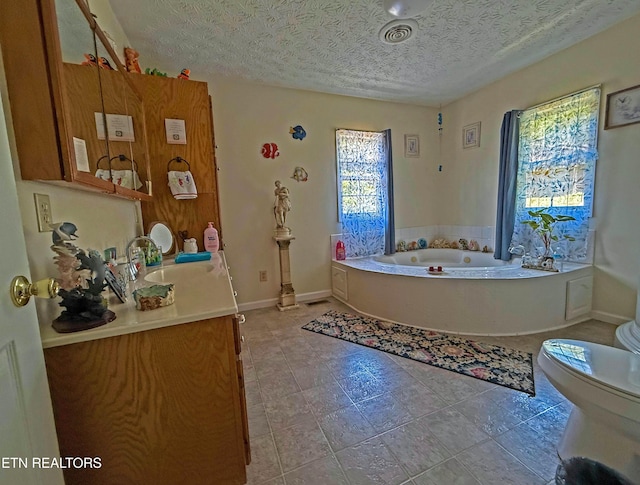 805 Punkton Rd, Del Rio, TN 37727 - bathroom featuring vanity, a bath, a textured ceiling, and tile patterned flooring