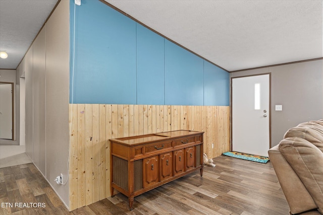 90 Byers Ln, Crossville, TN 38571 - foyer entrance with wood finished floors, wood walls, wainscoting, a textured ceiling, and vaulted ceiling