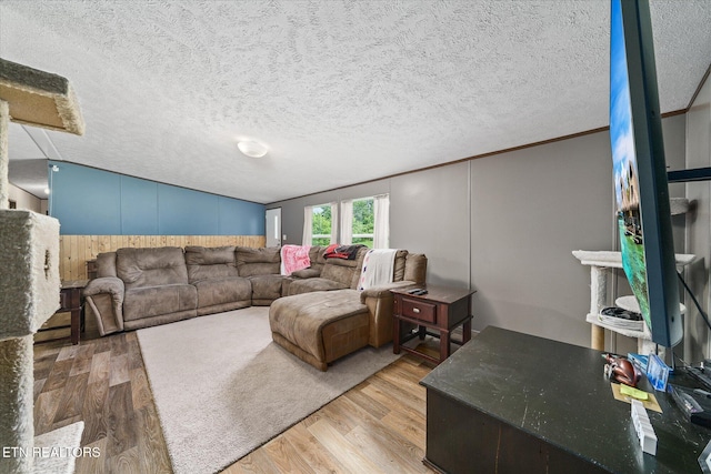 90 Byers Ln, Crossville, TN 38571 - living area with wood finished floors, lofted ceiling, a textured ceiling, and crown molding