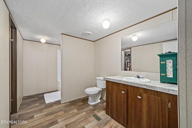 90 Byers Ln, Crossville, TN 38571 - bathroom featuring wood finished floors, vanity, a textured ceiling, and shower / bath combination with curtain