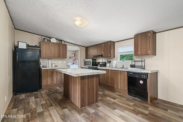 90 Byers Ln, Crossville, TN 38571 - kitchen featuring black appliances, dark wood-style floors, washer / dryer, light countertops, and a textured ceiling