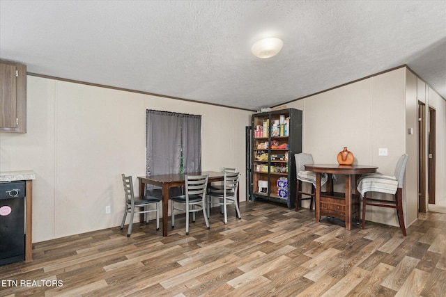 90 Byers Ln, Crossville, TN 38571 - dining space with light wood-style flooring, a textured ceiling, and ornamental molding