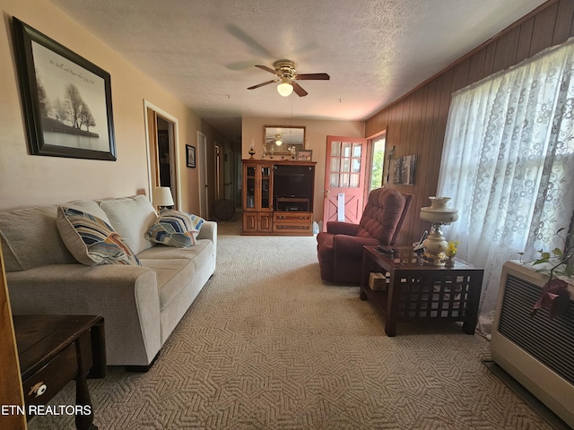 1106 Smyth Chapel Rd, Pennington Gap, VA 24277 - carpeted living area with ceiling fan, a textured ceiling, and wood walls