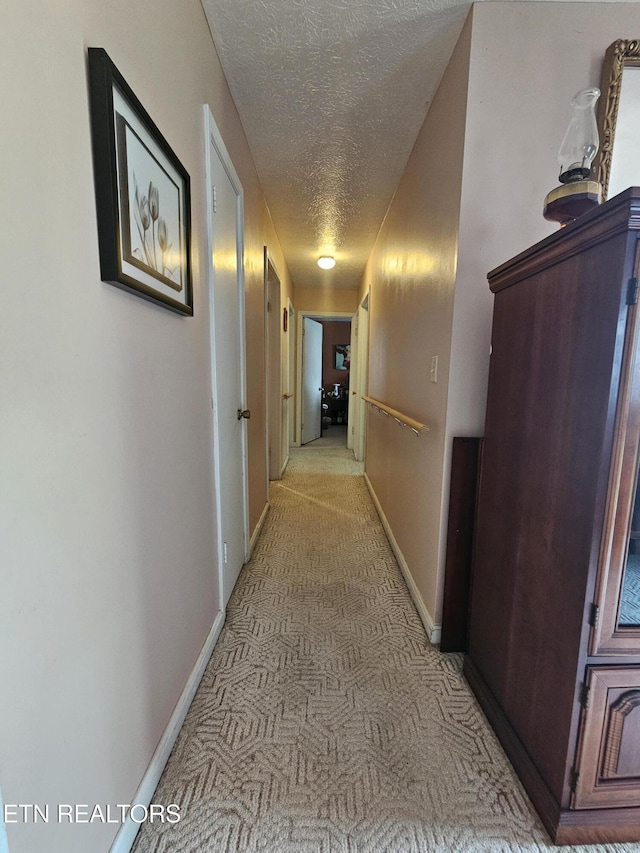 1106 Smyth Chapel Rd, Pennington Gap, VA 24277 - corridor featuring light carpet and a textured ceiling