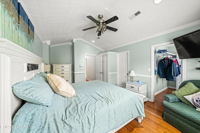 1476 Pheasants Glen Dr, Knoxville, TN 37923 - bedroom featuring crown molding, wood finished floors, a walk in closet, vaulted ceiling, and a closet