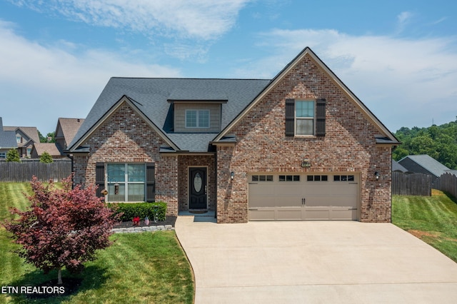 12504 Tangle Crest Ln, Knoxville, TN 37932 - view of front of home featuring driveway, brick siding, roof with shingles, and an attached garage