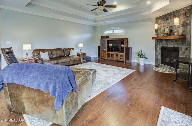 12504 Tangle Crest Ln, Knoxville, TN 37932 - living room featuring a tray ceiling, crown molding, ceiling fan, wood-type flooring, and a fireplace