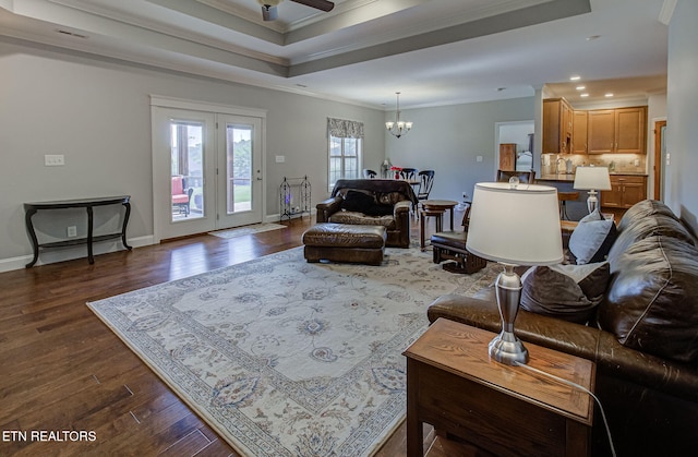 12504 Tangle Crest Ln, Knoxville, TN 37932 - living room with crown molding, dark wood-type flooring, a chandelier, a ceiling fan, and recessed lighting