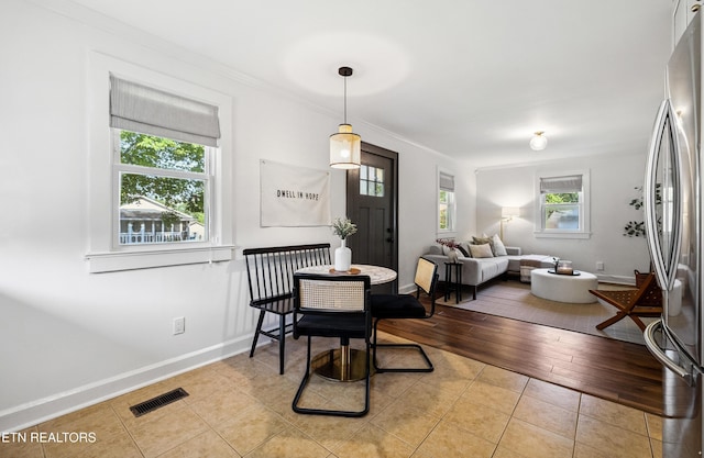 806 S Everett High Rd, Maryville, TN 37804 - dining space featuring healthy amount of natural light, light tile patterned flooring, and ornamental molding