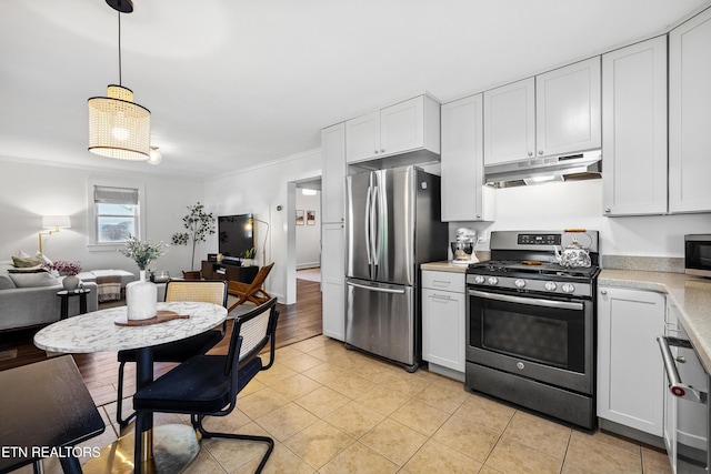 806 S Everett High Rd, Maryville, TN 37804 - kitchen with stainless steel appliances, under cabinet range hood, crown molding, light countertops, and light tile patterned floors