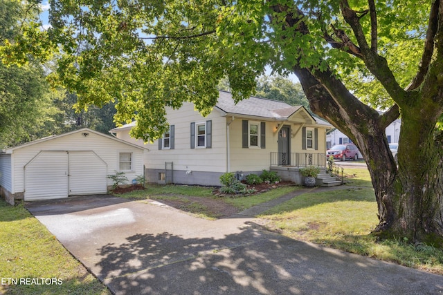 806 S Everett High Rd, Maryville, TN 37804 - view of front of home featuring concrete driveway, an outdoor structure, a front yard, and a shingled roof