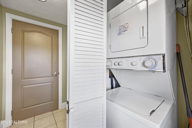 818 Golf View Blvd Unit 1502, Pigeon Forge, TN 37863 - laundry area with stacked washer / dryer and light tile patterned floors