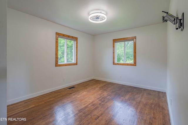 213 Towne Rd, Knoxville, TN 37934 - empty room with healthy amount of natural light and wood finished floors