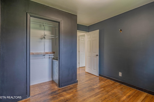 213 Towne Rd, Knoxville, TN 37934 - unfurnished bedroom featuring wood finished floors and a closet