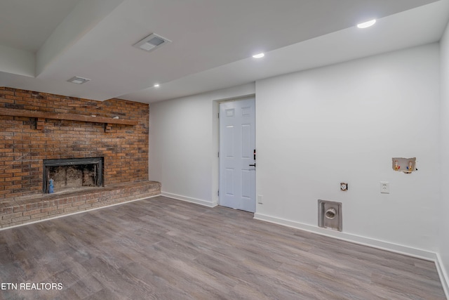213 Towne Rd, Knoxville, TN 37934 - unfurnished living room with wood finished floors, a fireplace, and recessed lighting