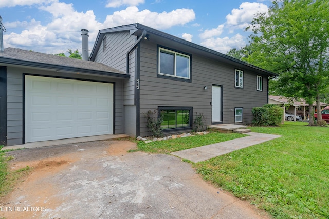 213 Towne Rd, Knoxville, TN 37934 - view of front of house with driveway, a front yard, and a garage