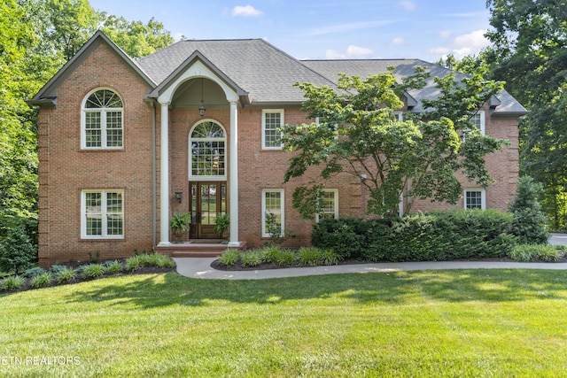 11424 Gates Mill Dr, Knoxville, TN 37934 - view of front of property with a front yard, brick siding, and roof with shingles