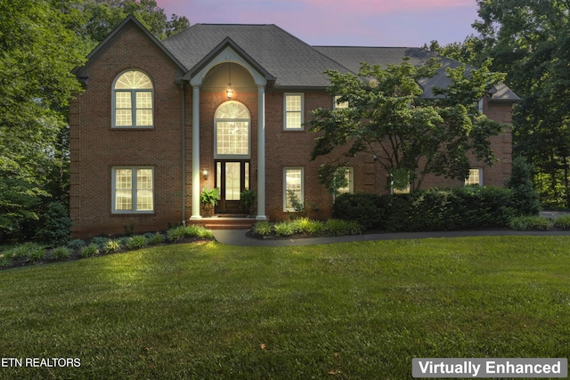 11424 Gates Mill Dr, Knoxville, TN 37934 - view of front of house with a front yard, brick siding, and roof with shingles