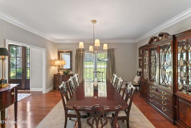 11424 Gates Mill Dr, Knoxville, TN 37934 - dining space featuring healthy amount of natural light, ornamental molding, a chandelier, and dark wood-style floors
