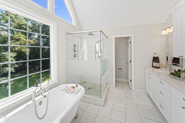 11424 Gates Mill Dr, Knoxville, TN 37934 - bathroom with healthy amount of natural light, a freestanding tub, and a stall shower