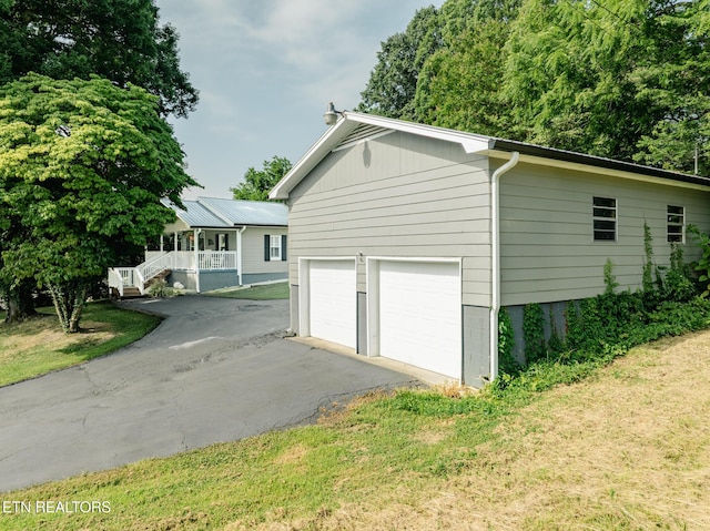 4139 Browder Hollow Rd, Lenoir City, TN 37771 - view of side of property featuring a porch, a lawn, and a detached garage