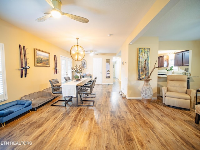 4139 Browder Hollow Rd, Lenoir City, TN 37771 - dining room featuring a ceiling fan, wood finished floors, and a chandelier