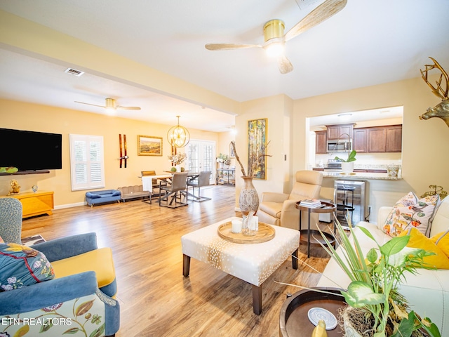 4139 Browder Hollow Rd, Lenoir City, TN 37771 - living area with a ceiling fan, light wood finished floors, and a chandelier