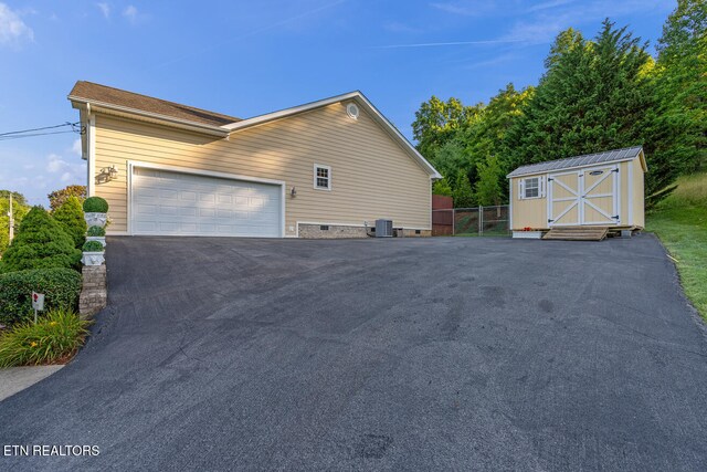 505 Bugaboo Springs Rd, Jonesborough, TN 37659 - view of side of property featuring a storage shed and asphalt driveway
