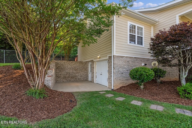 505 Bugaboo Springs Rd, Jonesborough, TN 37659 - view of home's exterior featuring brick siding, a patio, and a garage