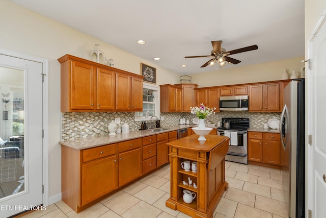 505 Bugaboo Springs Rd, Jonesborough, TN 37659 - kitchen with stainless steel appliances, a ceiling fan, tasteful backsplash, a center island, and recessed lighting