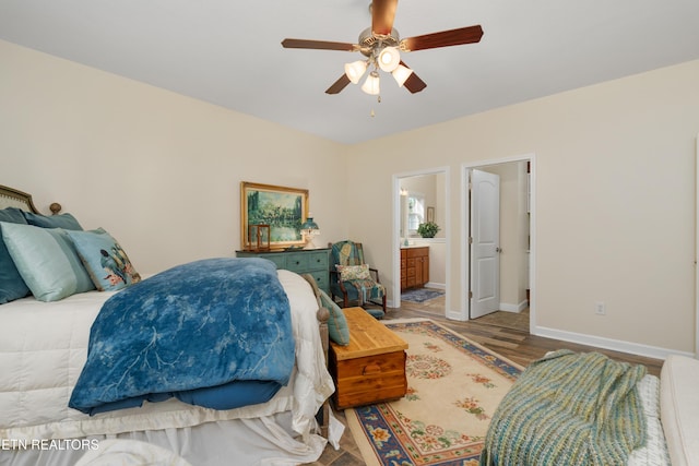 505 Bugaboo Springs Rd, Jonesborough, TN 37659 - bedroom featuring connected bathroom, wood finished floors, and ceiling fan