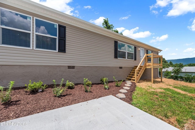308 Cowan Ln, Lafollette, TN 37766 - view of side of property with stairs, a patio, crawl space, and a wooden deck
