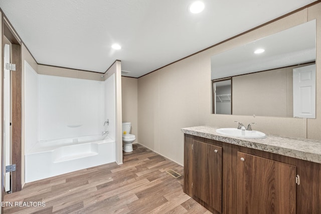 308 Cowan Ln, Lafollette, TN 37766 - full bath featuring vanity, wood finished floors, recessed lighting, and shower / washtub combination