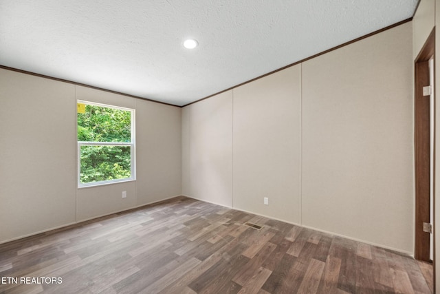 308 Cowan Ln, Lafollette, TN 37766 - empty room featuring ornamental molding, wood finished floors, a textured ceiling, and recessed lighting
